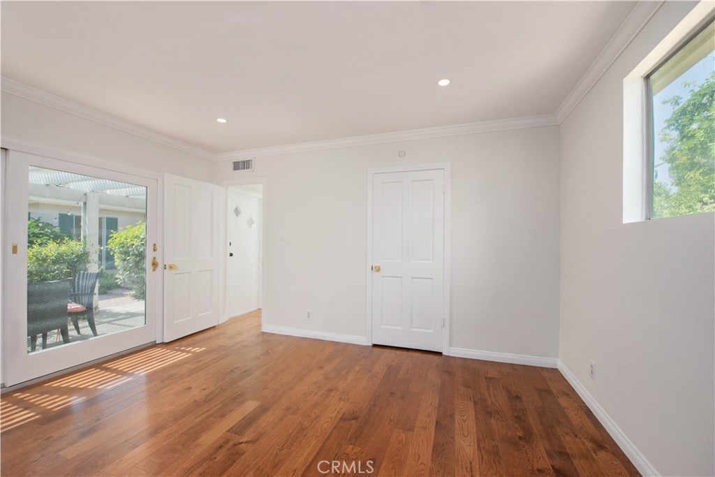 4722 Forman Lane Toluca Lake, CA 91602 - Photo 30 of 52 a view of a room with wooden floor and window