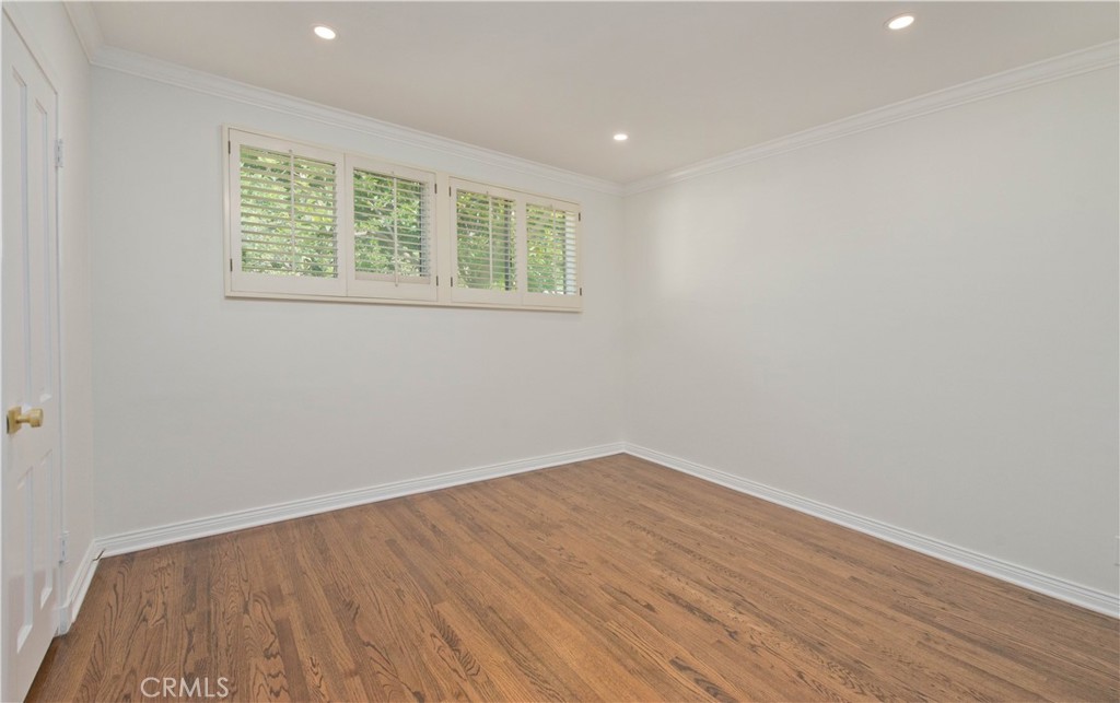 4722 Forman Lane Toluca Lake, CA 91602 - Photo 36 of 52 wooden floor in an empty room with a window