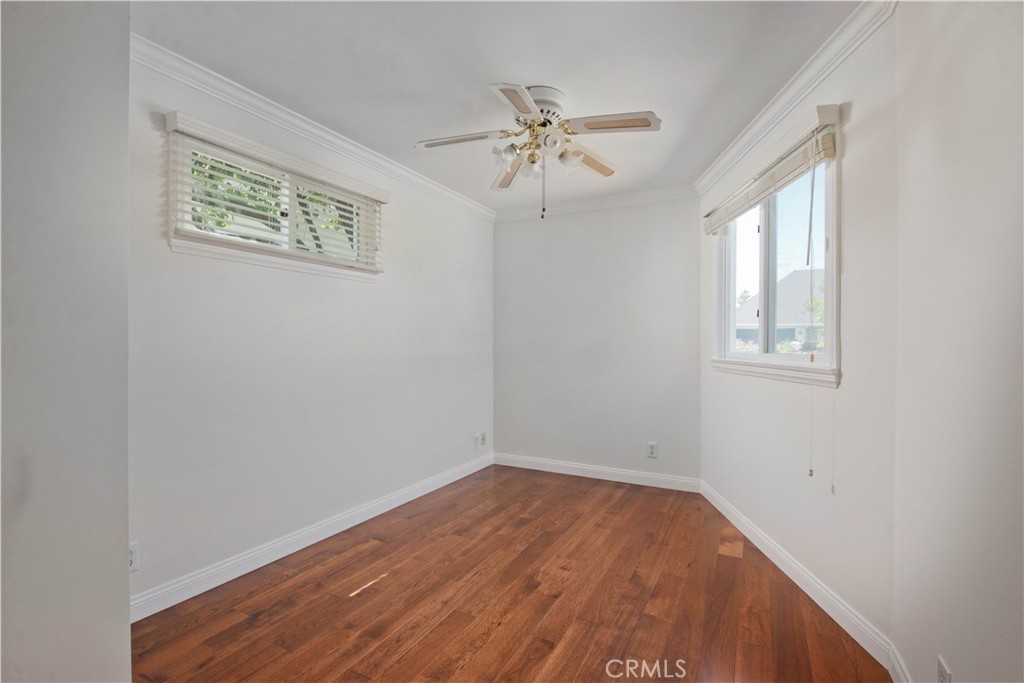 4722 Forman Lane Toluca Lake, CA 91602 - Photo 38 of 52 a view of an empty room with wooden floor and a window