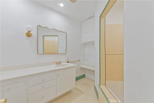a view of kitchen with white cabinets