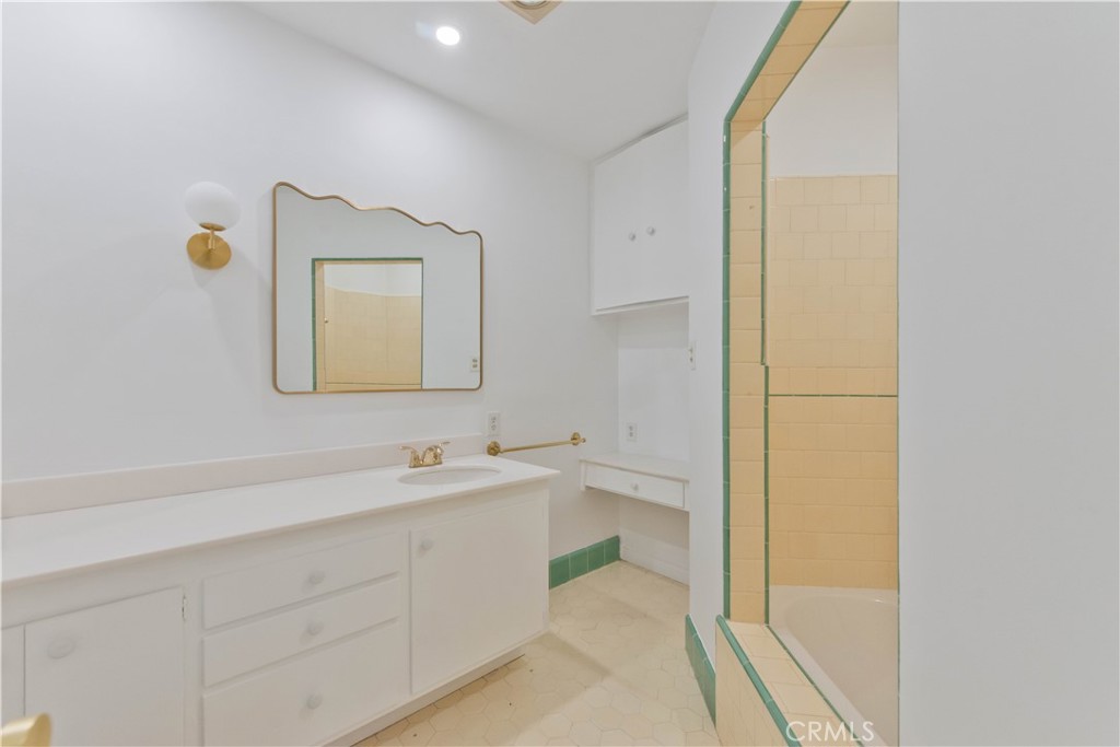 4722 Forman Lane Toluca Lake, CA 91602 - Photo 42 of 52 a bathroom with a toilet sink and mirror