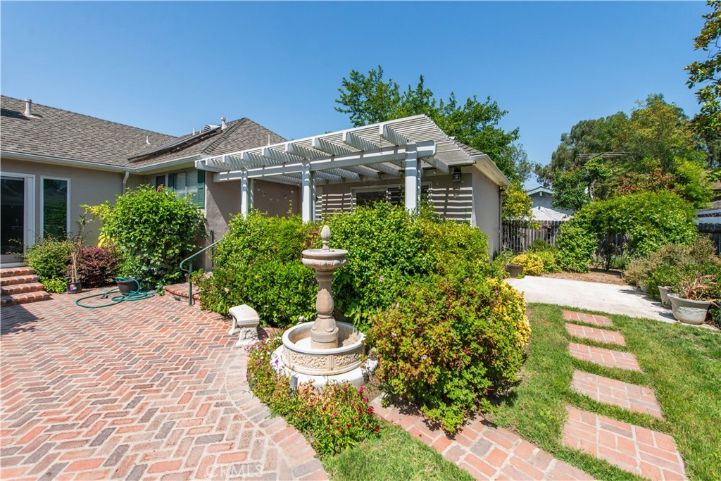 4722 Forman Lane Toluca Lake, CA 91602 - Photo 49 of 52 a front view of house with yard and trees around