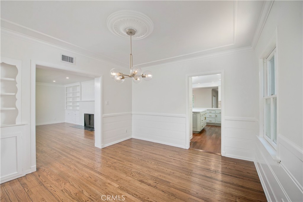 4722 Forman Lane Toluca Lake, CA 91602 - Photo 7 of 52 a view of empty room with wooden floor and ceiling fan