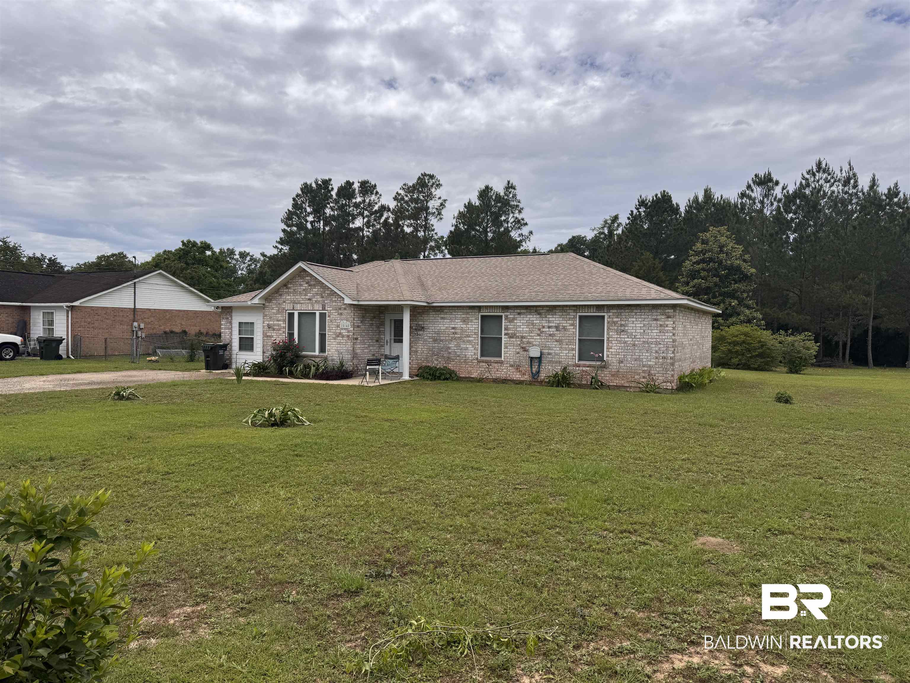 15148 Highland Circle Foley, AL 36535 - Photo 2 of 47 Ranch-style house featuring a front yard and brick siding