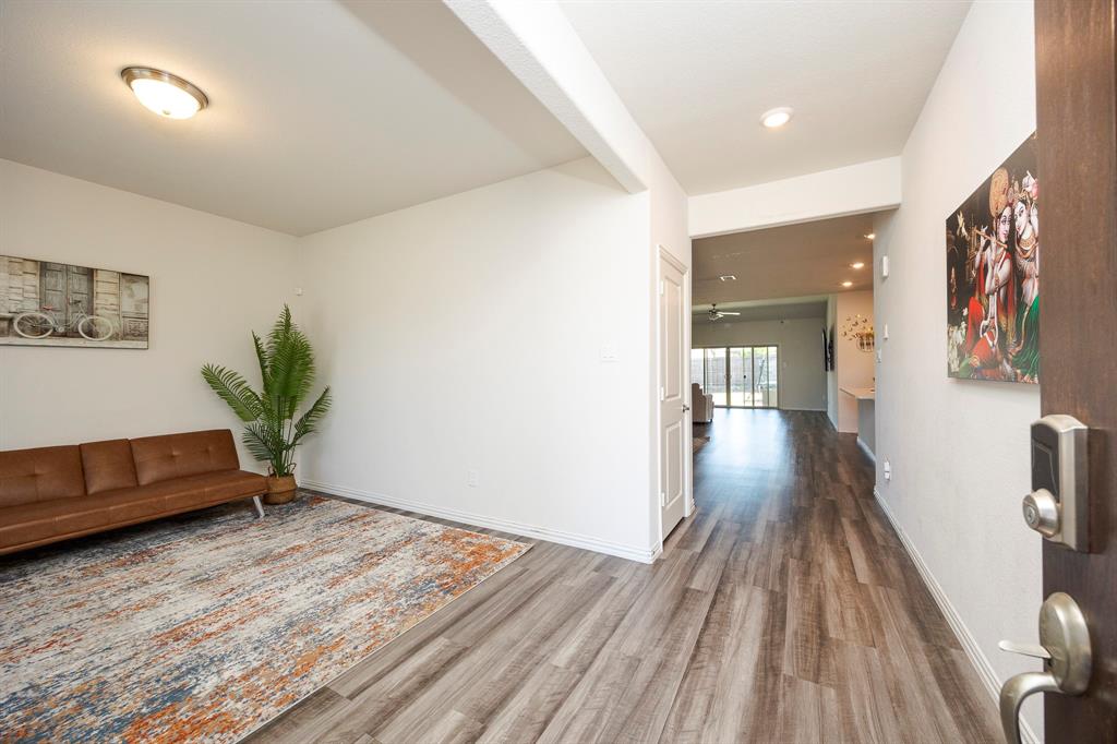 495 Fox Ridge Drive Princeton, TX 75407 - Photo 4 of 31 Wood-finish flooring throughout, recessed ceiling lighting, and a white interior door