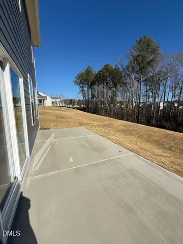 a view of an outdoor space and basketball court