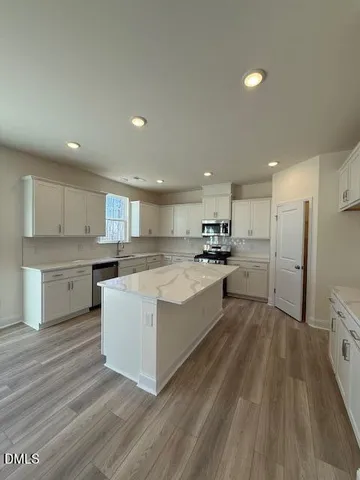 a large kitchen with a lot of counter top space