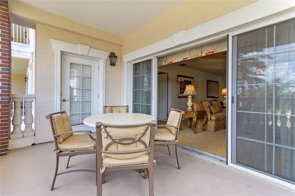 1106 Sunset View Circle, Unit 201 Reunion, FL 34747 - Photo 17 of 31 a dining room with furniture and a window
