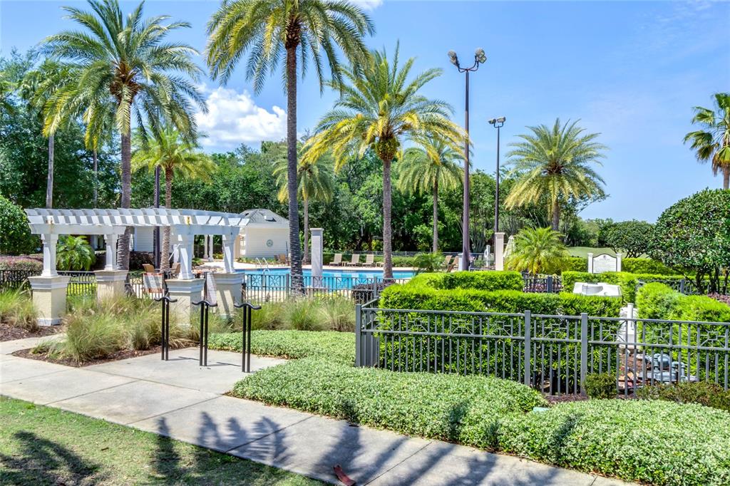 1106 Sunset View Circle, Unit 201 Reunion, FL 34747 - Photo 21 of 31 a view of a palm trees front of house and swimming pool