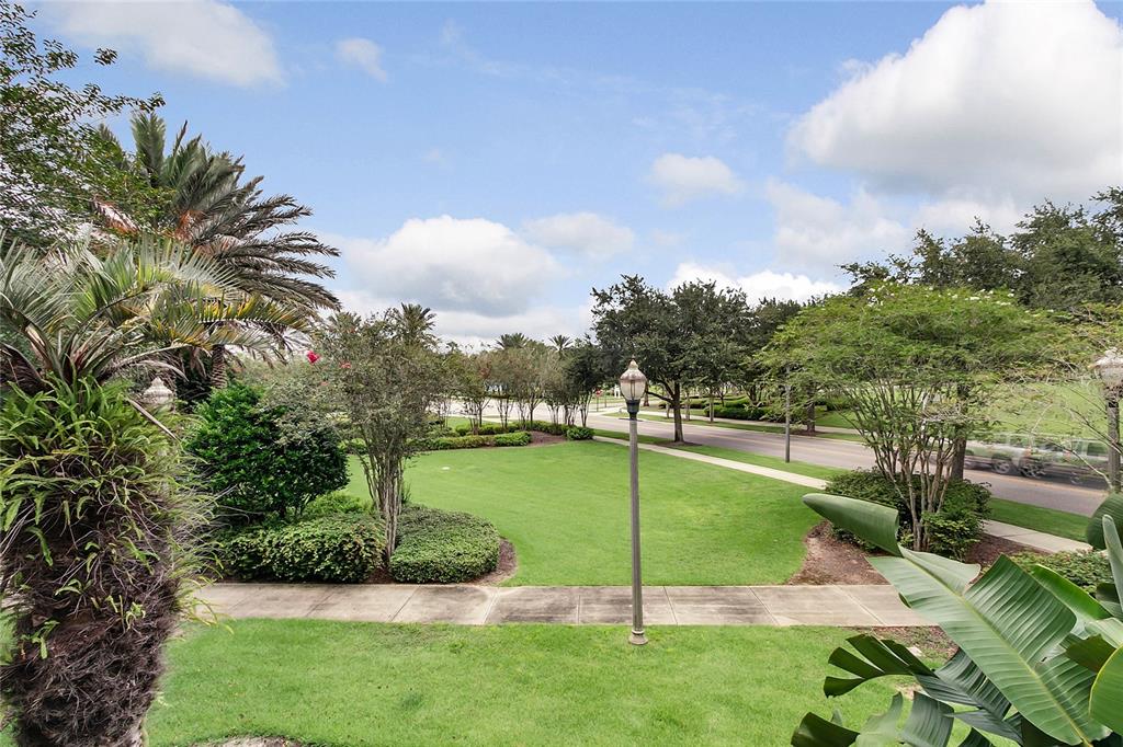 1106 Sunset View Circle, Unit 201 Reunion, FL 34747 - Photo 22 of 31 a view of a backyard with swimming pool