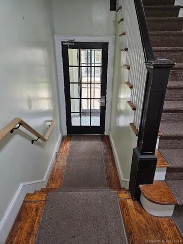 a view of entryway with wooden floor