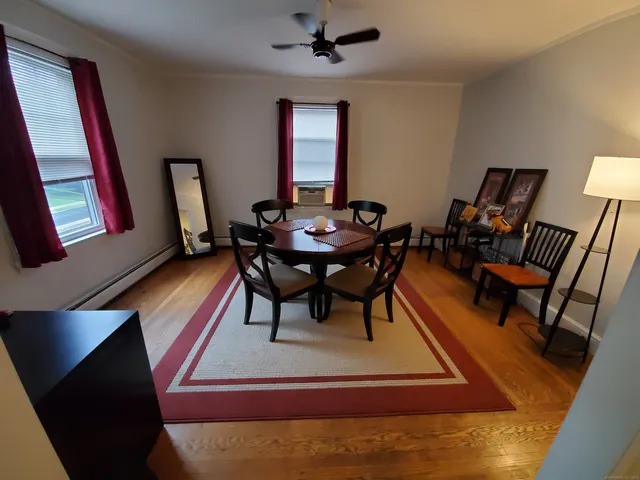 a living room with furniture and a rug