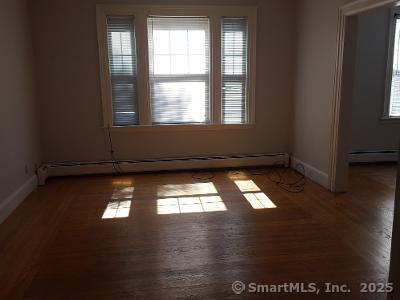 211 Fountain Street New Haven, CT 06515 - Photo 8 of 19 a view of empty room with wooden floor and windows