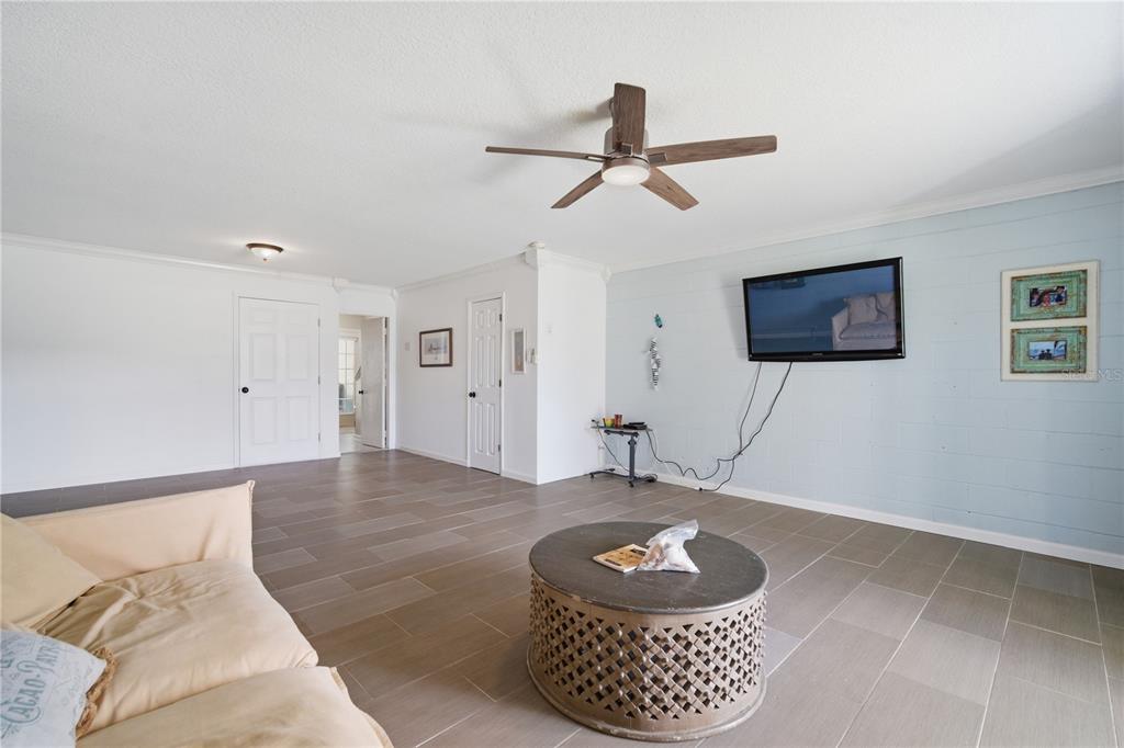 643 Garland Circle Indian Rocks Beach, FL 33785 - Photo 11 of 81 a living room with a couch and a rug