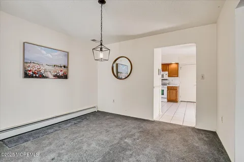 a kitchen with stainless steel appliances granite countertop a sink and a refrigerator