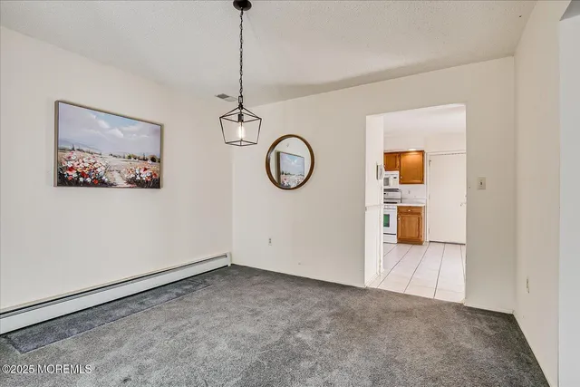 a kitchen with stainless steel appliances granite countertop a sink and a refrigerator