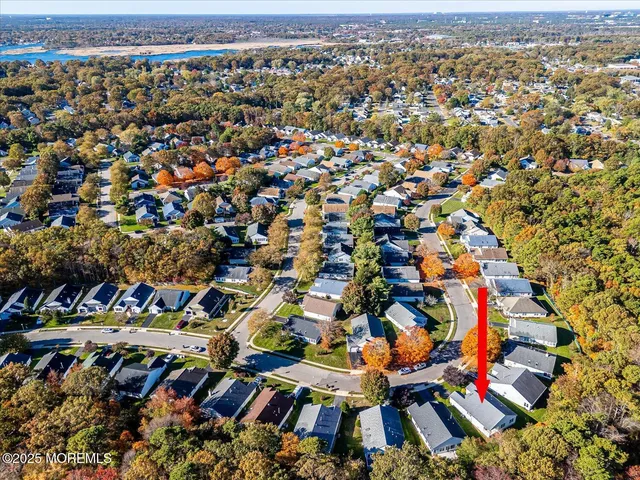a picture of street view with sitting space and garden view