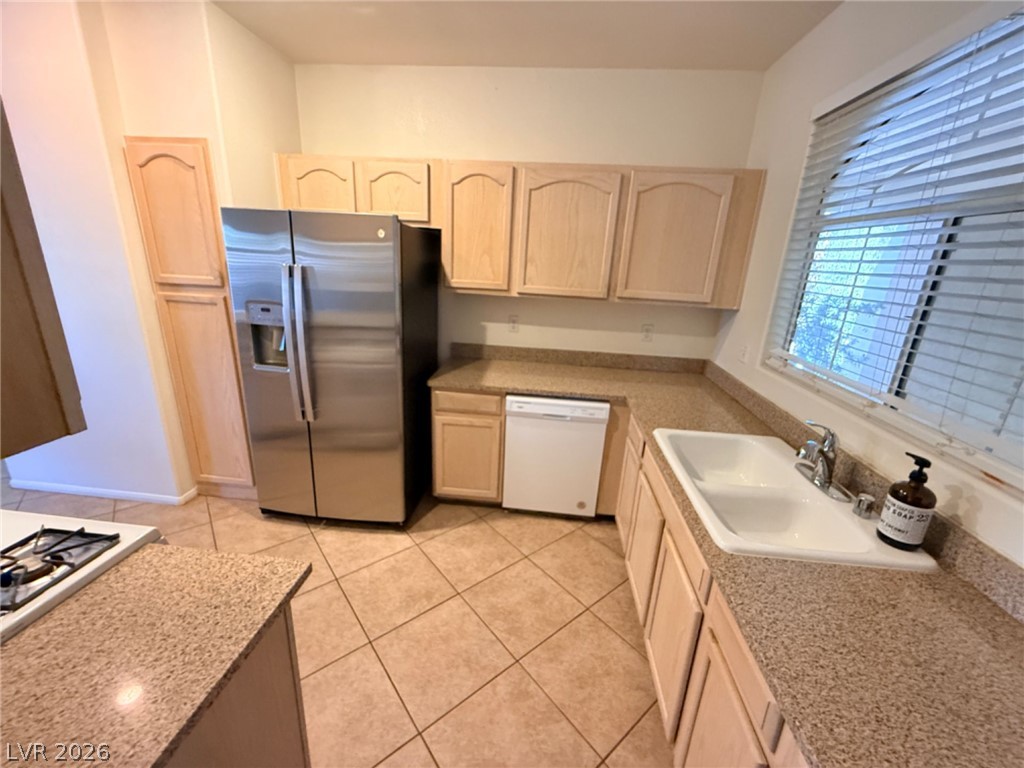 2050 West Warm Springs Road, Unit 3521 Henderson, NV 89014 - Photo 8 of 12 A well-appointed kitchen features ample counter space and essential appliances for everyday living.