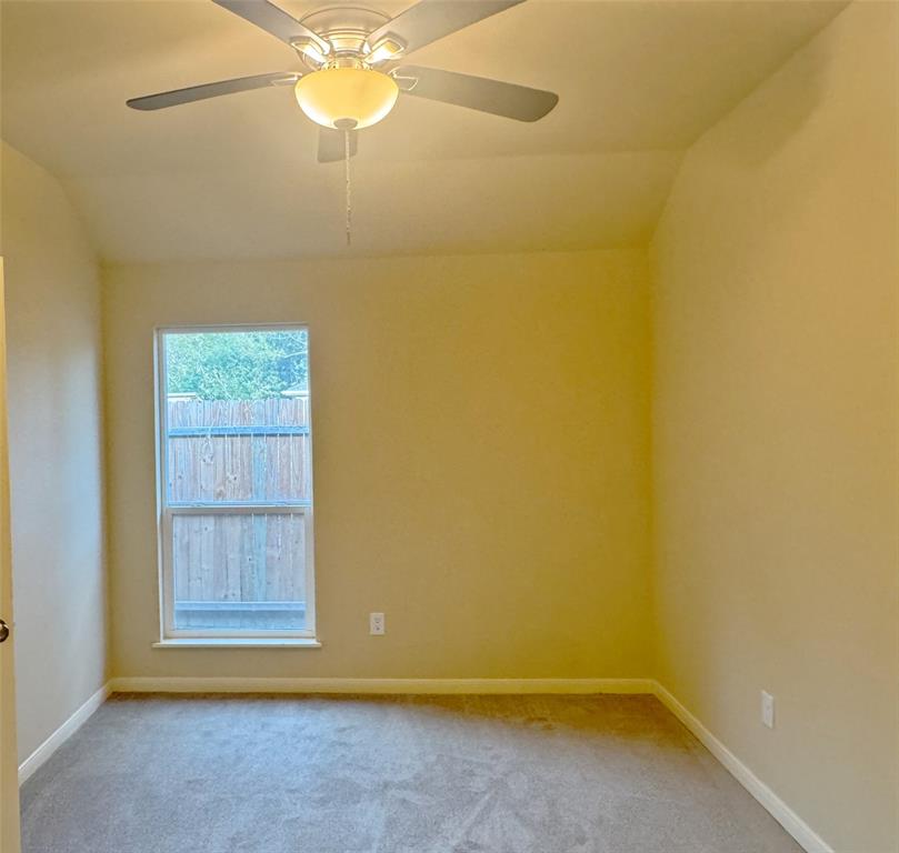 3912 Oneal Street Greenville, TX 75401 - Photo 14 of 20 a view of room with window and ceiling fan