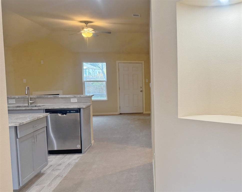 3912 Oneal Street Greenville, TX 75401 - Photo 3 of 20 a view of a kitchen with a sink and chandelier