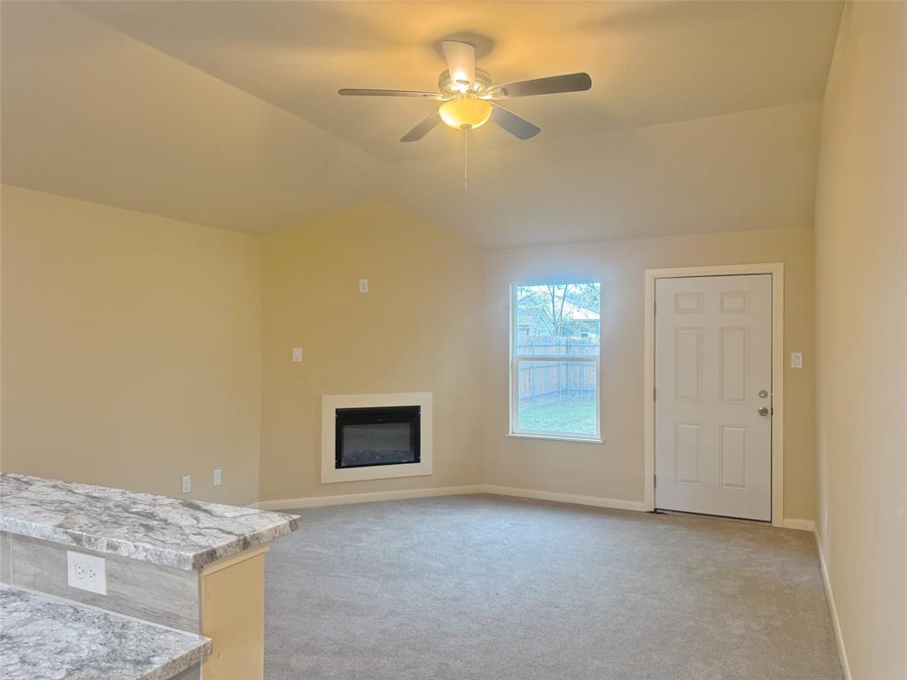 3912 Oneal Street Greenville, TX 75401 - Photo 7 of 20 a view of an empty room and fire place