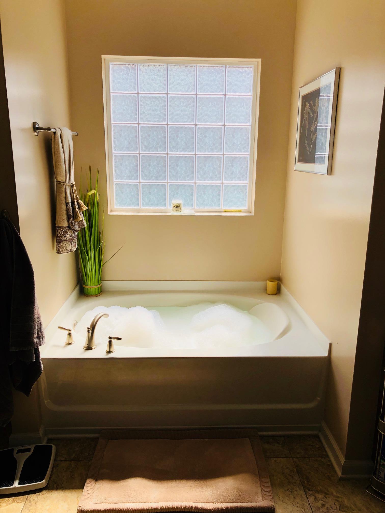 6033 Cane Springs Road Antioch, TN 37013 - Photo 13 of 28 a bathroom with a bathtub and a sink