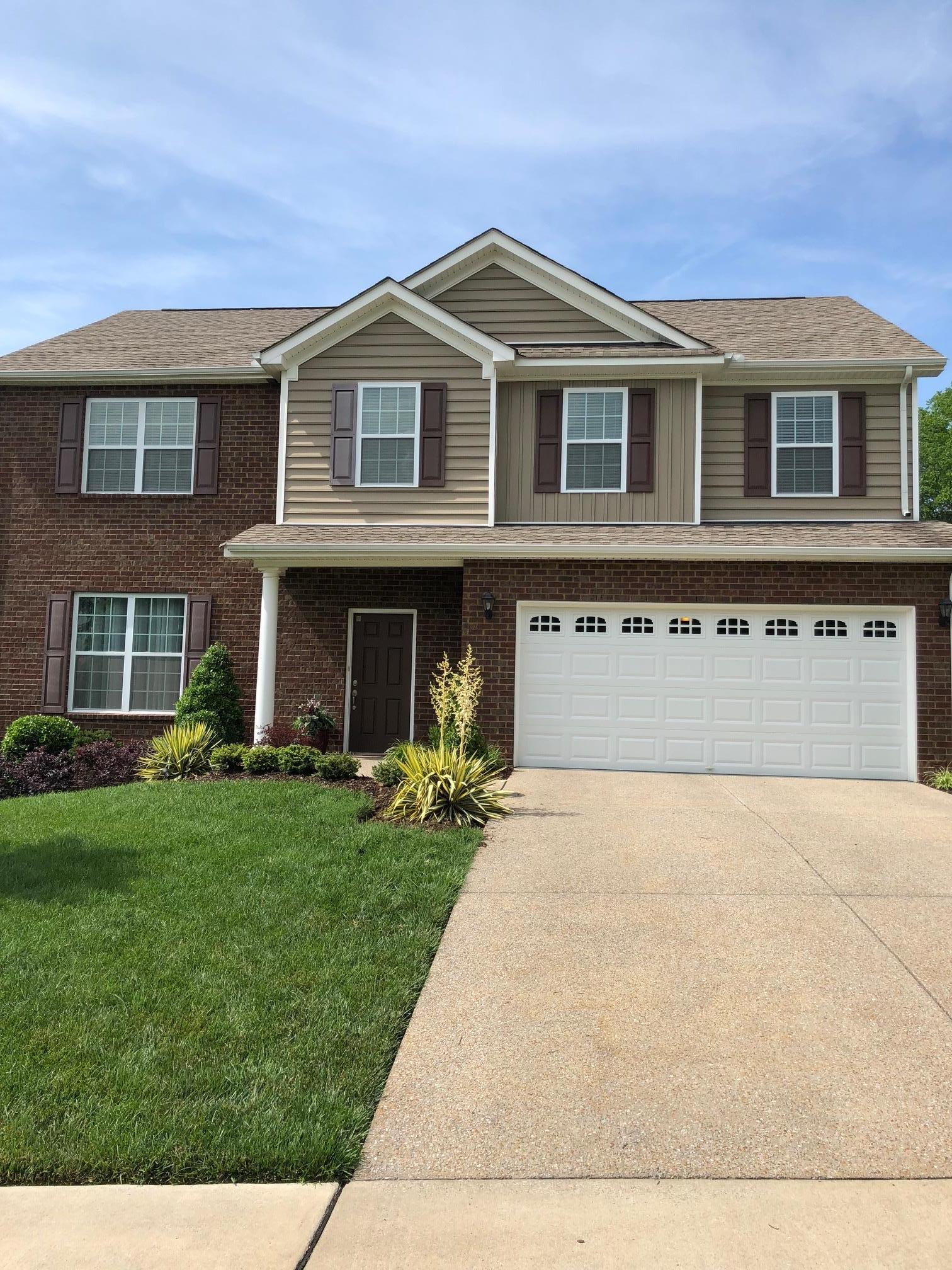 6033 Cane Springs Road Antioch, TN 37013 - Photo 2 of 28 a front view of a house with a yard