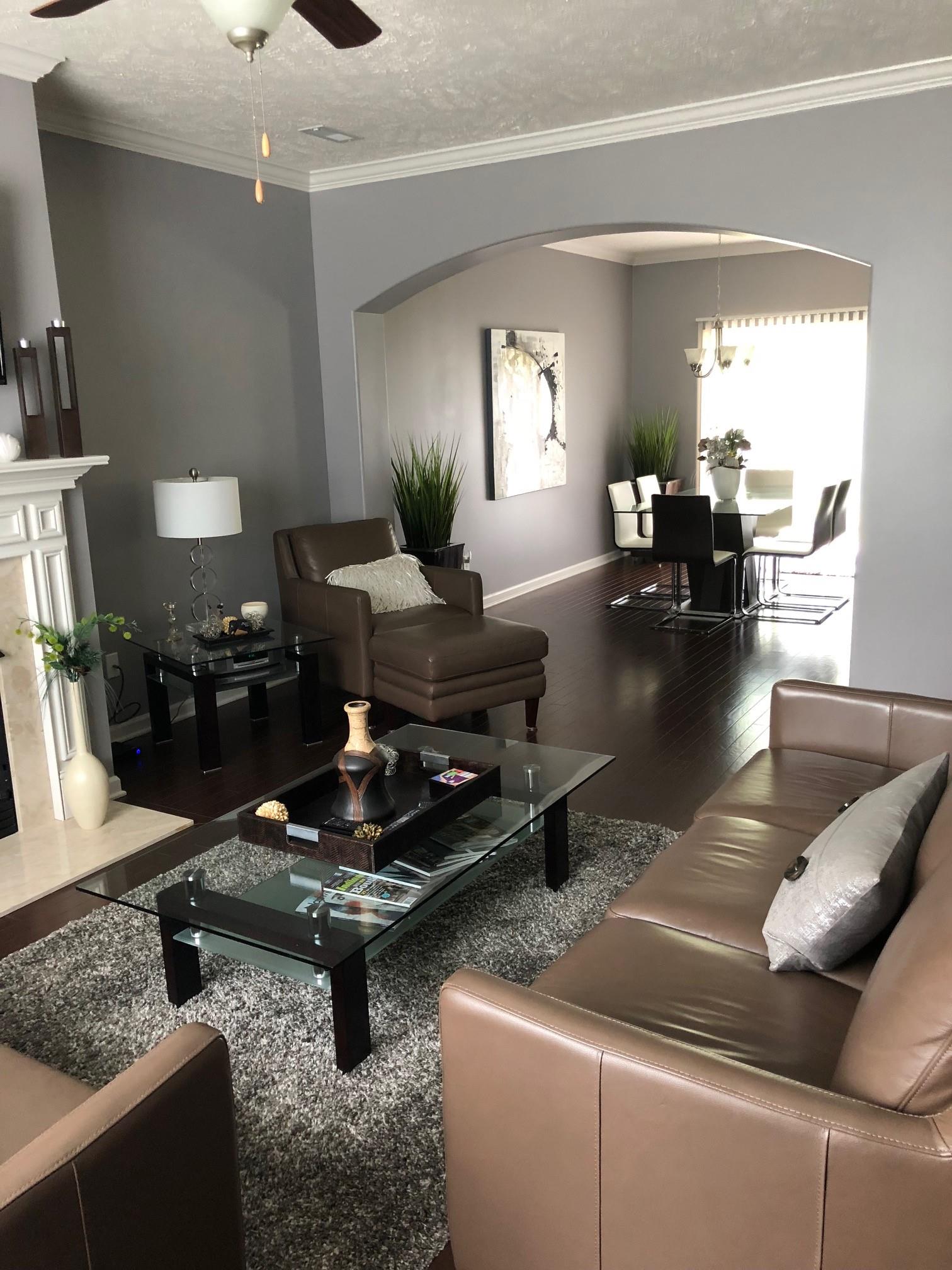 6033 Cane Springs Road Antioch, TN 37013 - Photo 6 of 28 a living room with furniture and a chandelier
