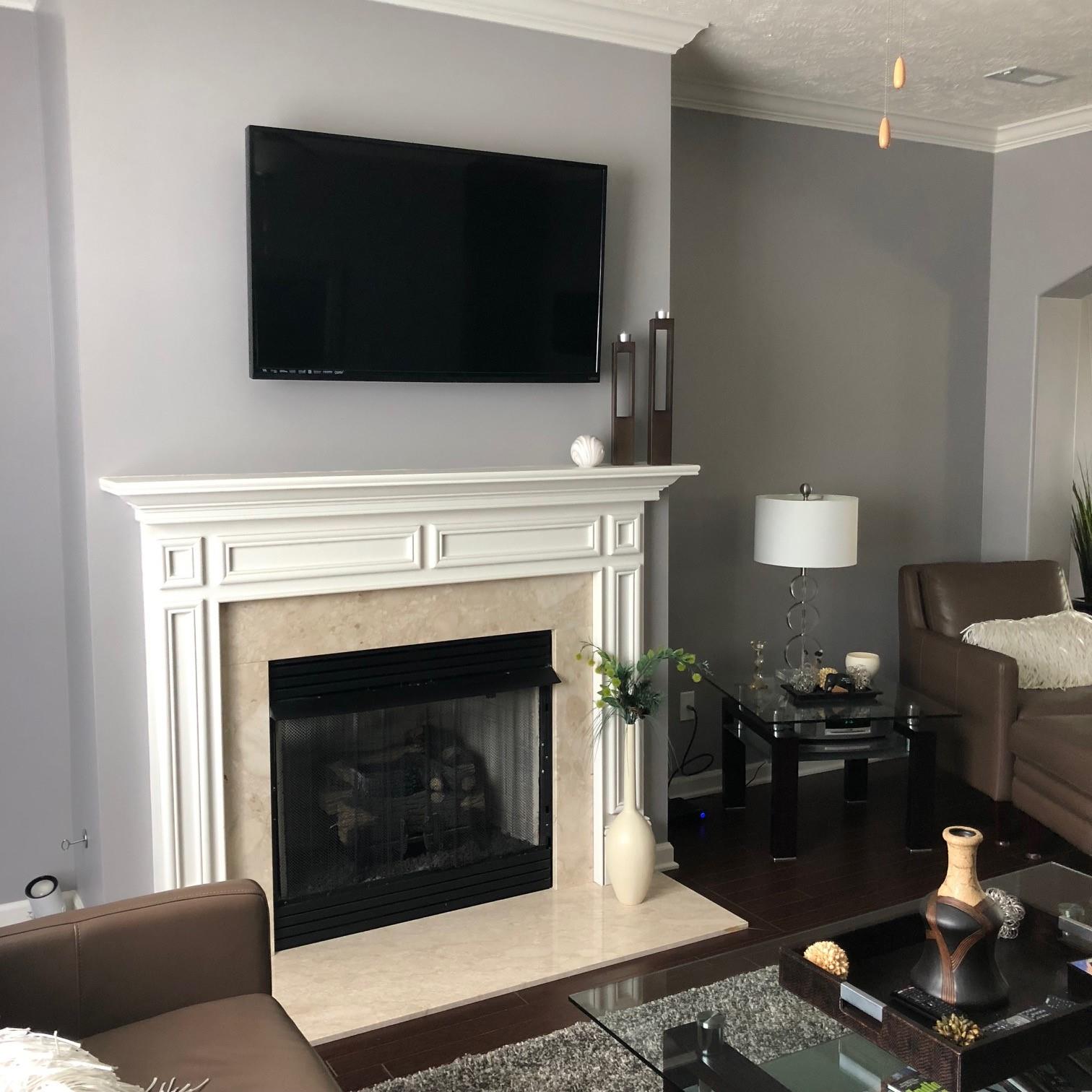 6033 Cane Springs Road Antioch, TN 37013 - Photo 7 of 28 a living room with furniture a flat screen tv and a fireplace