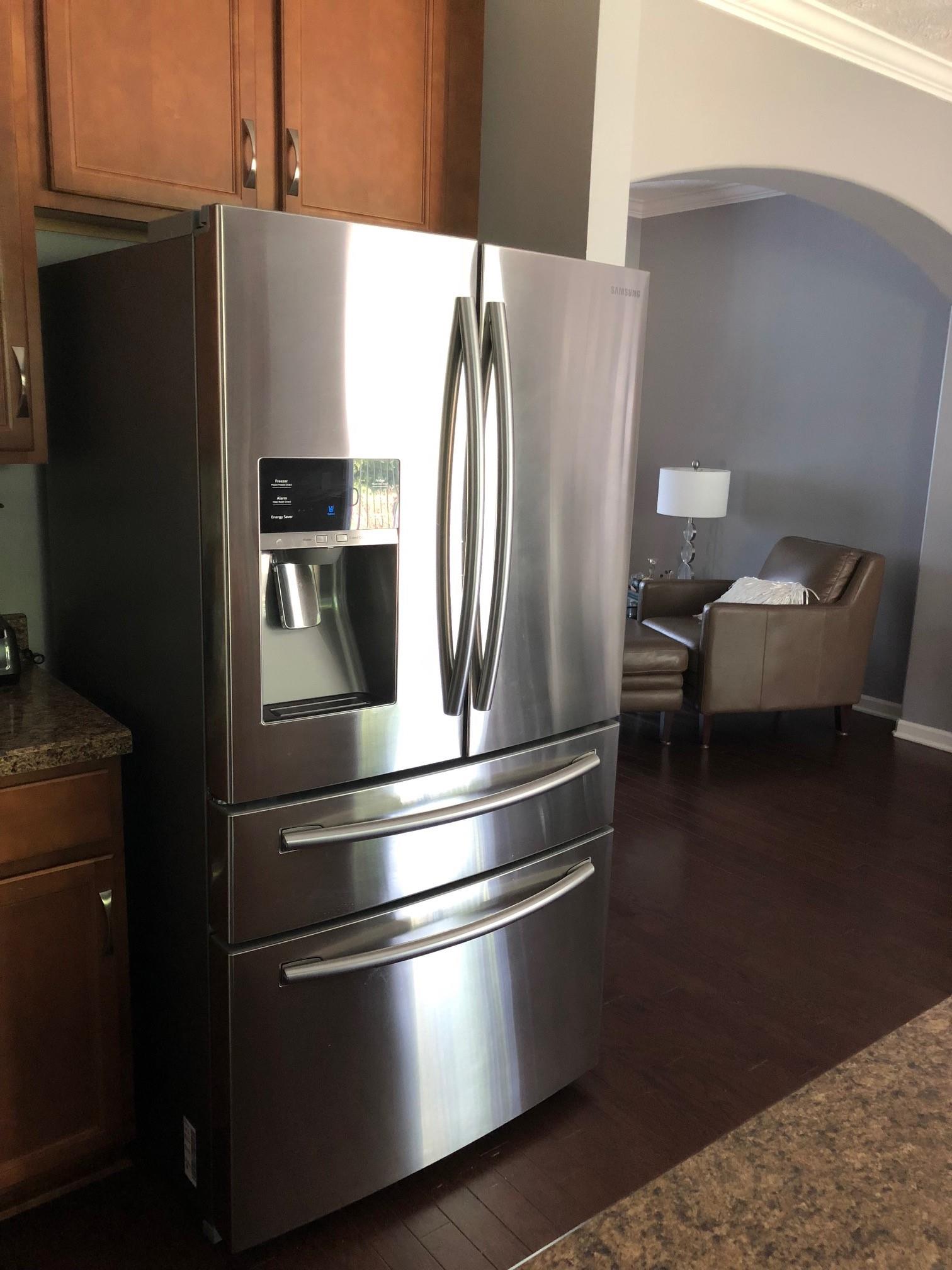 6033 Cane Springs Road Antioch, TN 37013 - Photo 9 of 28 a metallic refrigerator freezer sitting inside of a kitchen