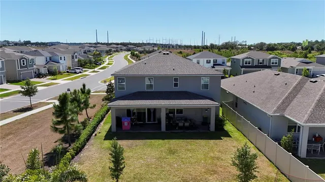 a aerial view of a house with a swimming pool