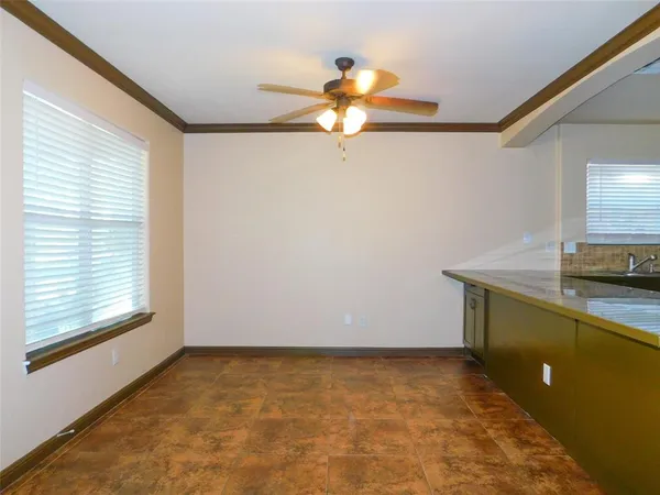 a view of a kitchen with a sink cabinets and a window