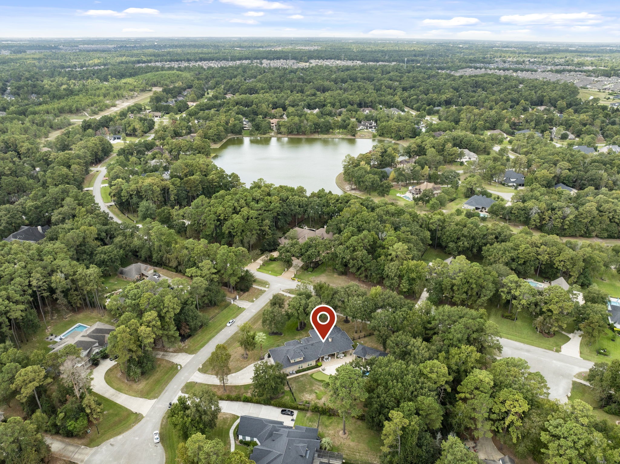4103 Tee Tree Court Spring, TX 77386 - Photo 35 of 37 A great perspective of the home's setting within Benders Landing—tucked on a cul-de-sac and surrounded by the neighborhood's signature large lots, mature trees, and nearby lake.