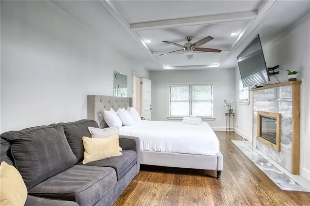 a bedroom with a bed and a fireplace