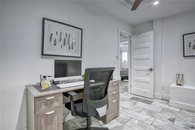 a large white bed in a white room