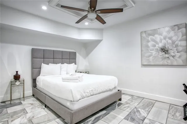 a room with pool table and windows