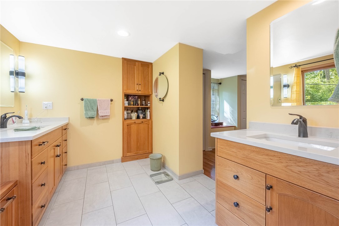 156 West Hadley Road Dayton, OH 45419 - Photo 29 of 71 This bright bathroom features a spacious layout, dual vanities, and ample storage.