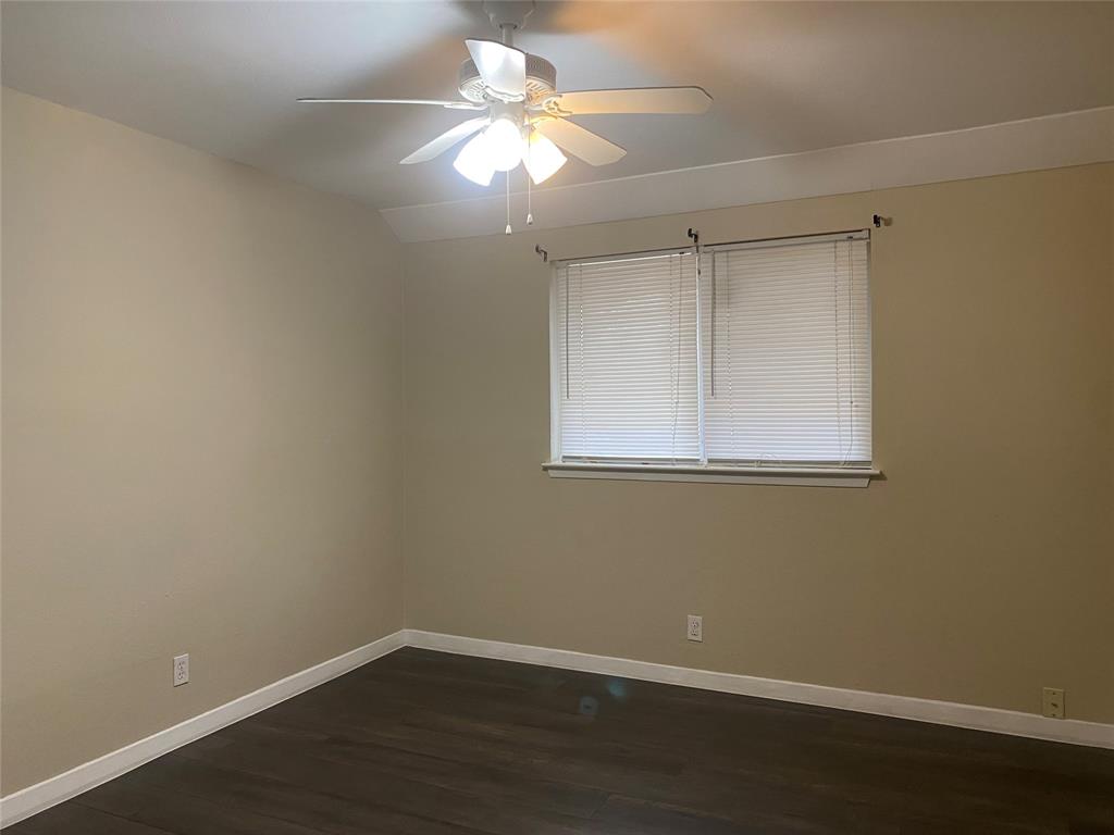 619 Arbor Lane Lancaster, TX 75134 - Photo 12 of 17 a view of a small space with wooden floor and a window