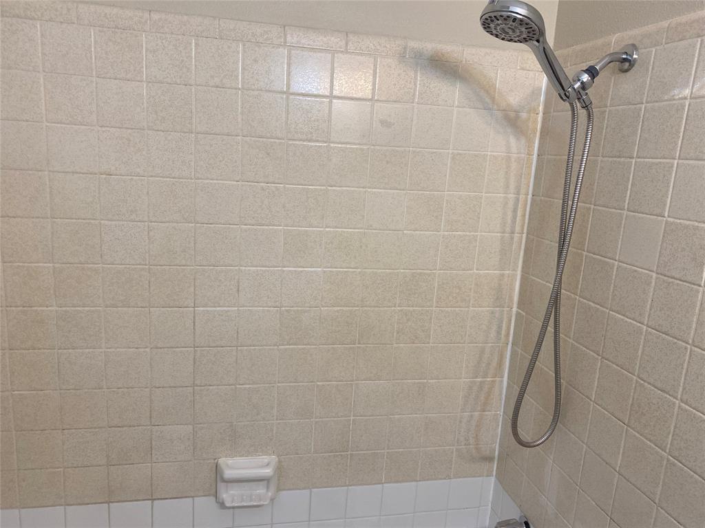 619 Arbor Lane Lancaster, TX 75134 - Photo 17 of 17 a bathroom with a shower