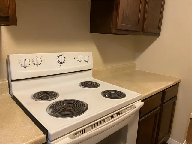 a kitchen with a stove and a microwave