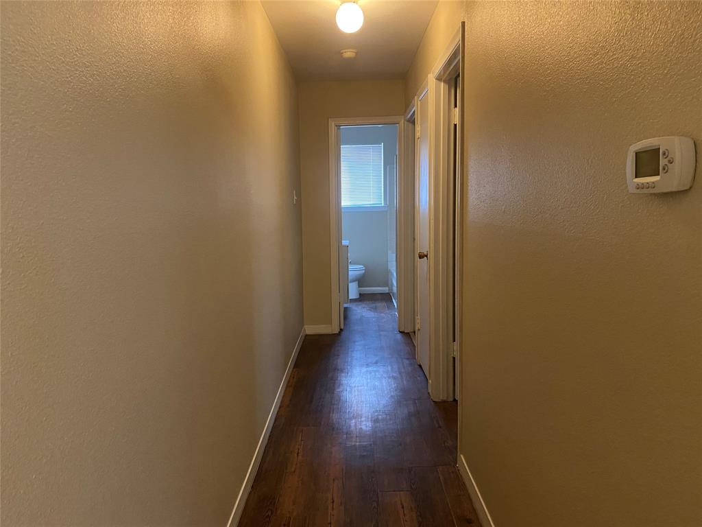 619 Arbor Lane Lancaster, TX 75134 - Photo 8 of 17 a view of a hallway with wooden floor