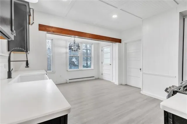 a view of a kitchen cabinets a sink and dishwasher in a kitchen