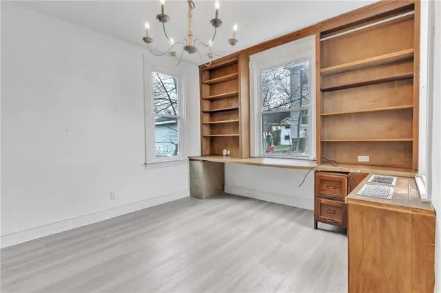 a view of workspace with window and cabinet