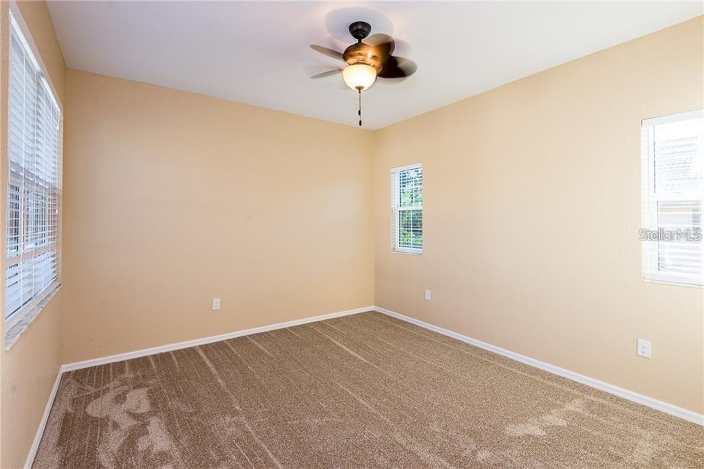3948 San Rocco Drive, Unit 112 Punta Gorda, FL 33950 - Photo 11 of 18 a view of a room with a window and a ceiling fan