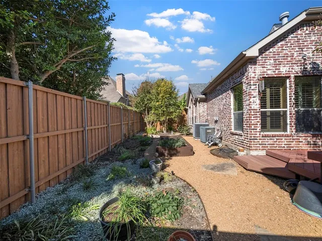 a view of a backyard with sitting area