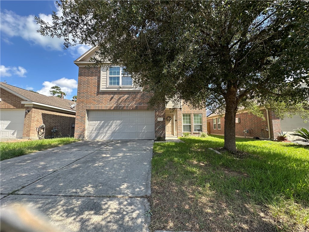 29475 Forest Spring Spring, TX 77373 - Photo 1 of 10 a front view of a house with garden