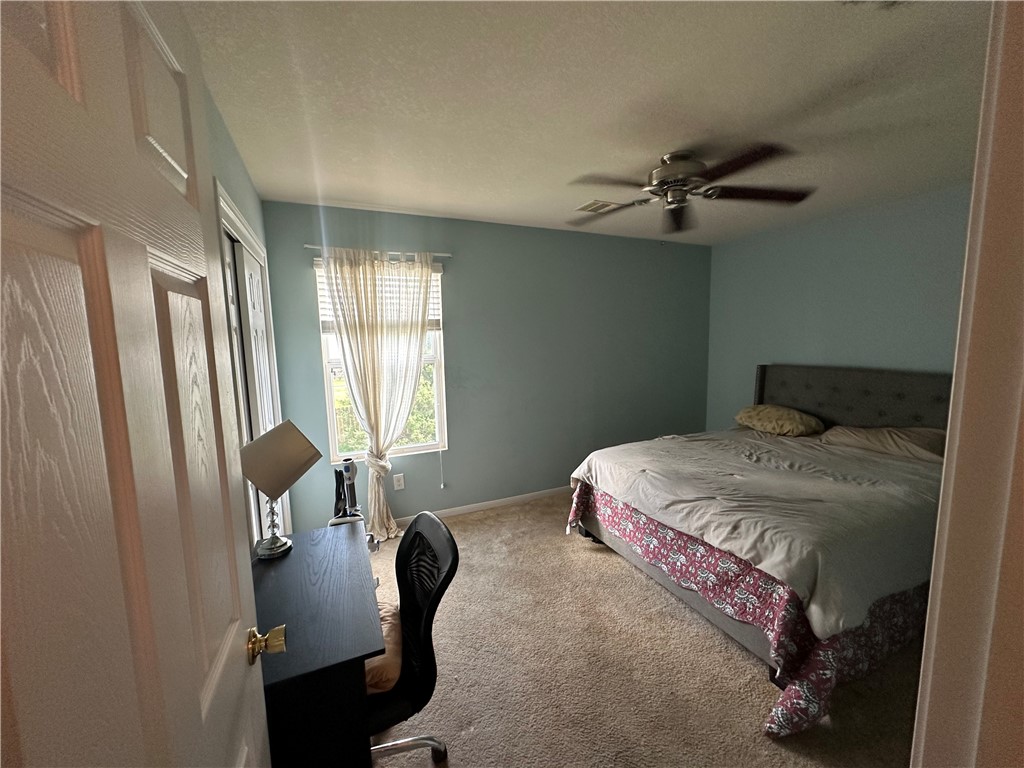 29475 Forest Spring Spring, TX 77373 - Photo 8 of 10 a bedroom with a bed chair and window