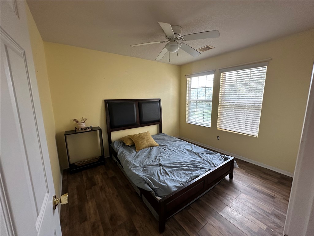 29475 Forest Spring Spring, TX 77373 - Photo 9 of 10 a bedroom with a bed and wooden floor