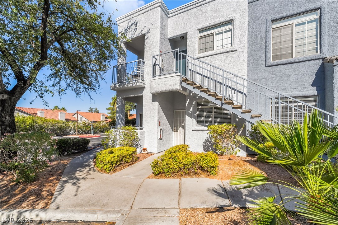 A striking multi-level residence with private balconies and mature landscaping.