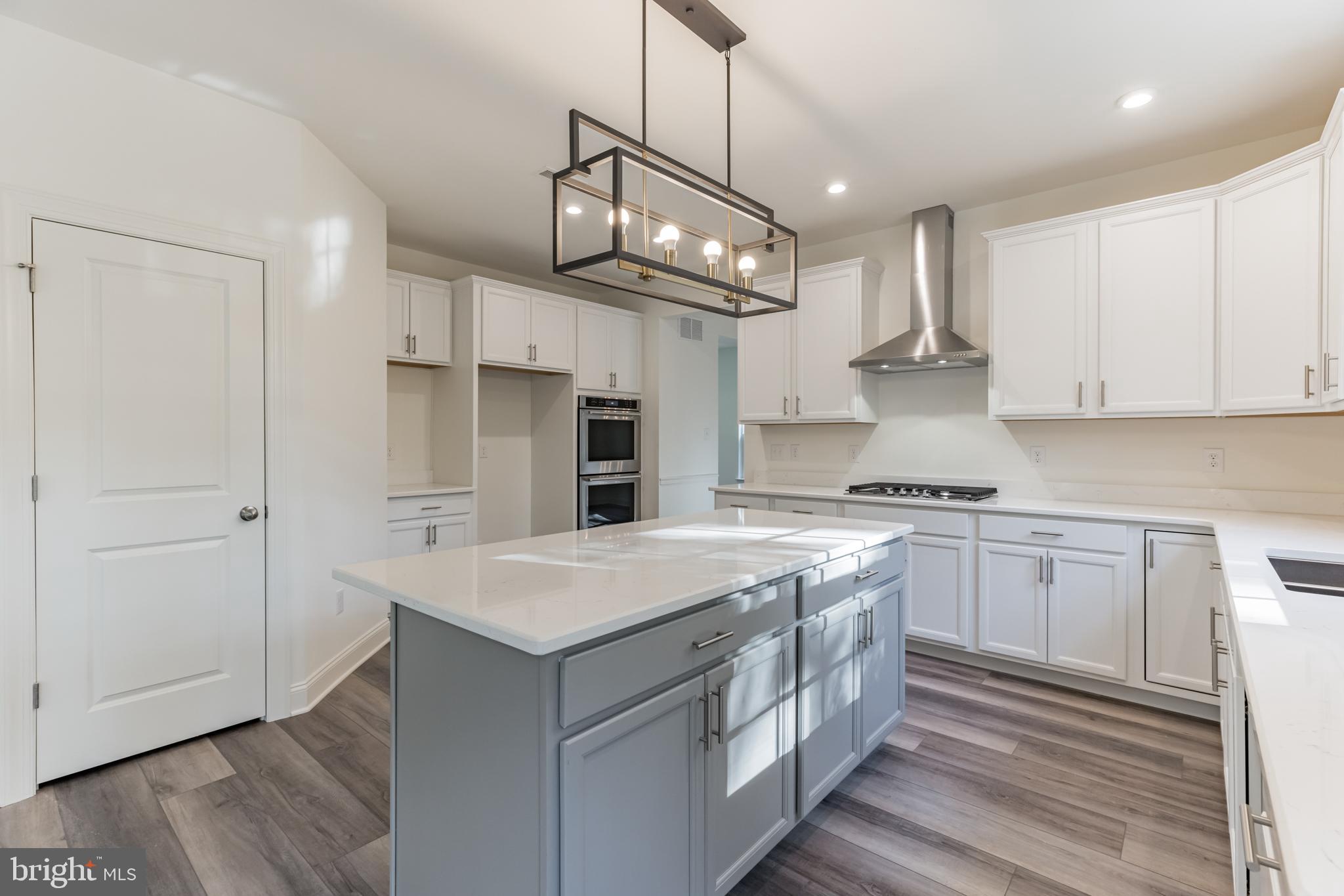 317 Ferrell Road Mullica Hill, NJ 08062 - Photo 11 of 31 a kitchen with stainless steel appliances granite countertop a sink a stove and a refrigerator